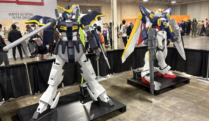 Two six foot tall Gundam figures at Anime North