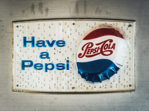 pepsi cola can on blue plastic bag